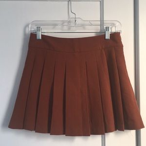 Orange pleated miniskirt